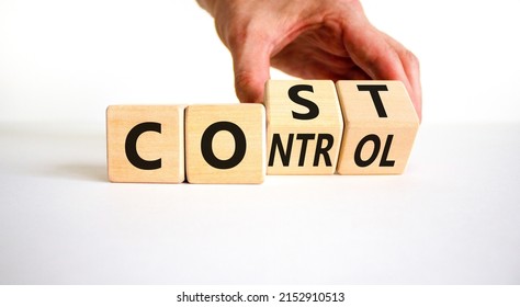 Cost control symbol. Businessman turns wooden cubes and changes the concept word Cost to Control. Beautiful white table white background, copy space. Business cost control concept.