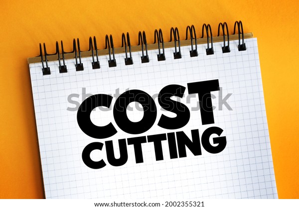 Cost\
Cutting - process used by companies to reduce their costs and\
increase their profits, text concept on\
notepad