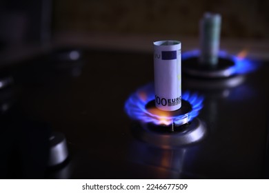 The cost of gas, the euro crisis. 100 euros on a gas burner. Sanctions Russian gas - Shutterstock ID 2246677509