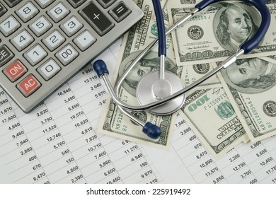 Cost Of Health Care Concept, Stethoscope And Calculator On Document 