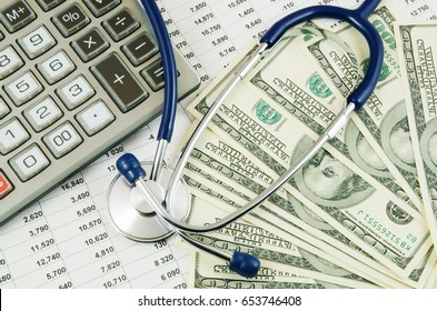 Cost Of Health Care Concept, Stethoscope And Calculator On Documents