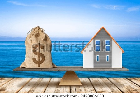 Cost of a house by the sea - Building activity and construction industry costs in seaside locations - Real estate concept with dollars and home model