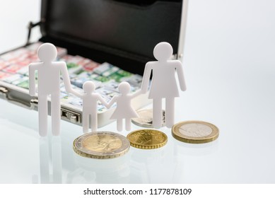 Cost Of Living, Money Loan, Family Finance And Child Trust Fund Concept : US Dollar In A Briefcase, Family Members Father, Mother, Son And Daughter, Depicts The Expenditure A Family Should Prepare For