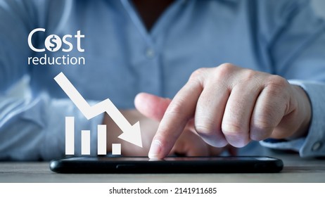 Cost Reduction Concept. Businessman With His Hand Lowers The Arrow Of The Graph. Cost Text With A Down Arrow. Budget,Cost Management