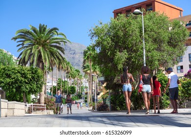 COSTA ADEJE, TENERIFE, SPAIN - CIRCA JAN, 2016: Central streets leads on the La Pinta beach. People walk on pathway. Costa Adeje is a town and municipality in the southwestern part of the island