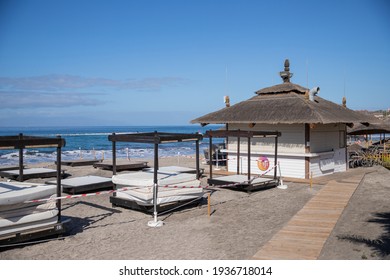 Costa Adeje, Tenerife, Spain, February 24th 2021: Beach Bar Closed With Warning Tapes Due To Restrictions For The Coronavirus Pandemic