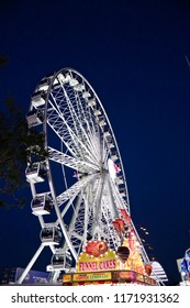 Costa Mesa, CA / USA - July 28, 2018: Ferris Wheel And Funnel Cake Stand At Night At The Orange County Fair 