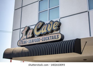 Costa Mesa, California/United States- 04/22/2019: A Store Front Sign For The Upscale Steakhouse Known As La Cave