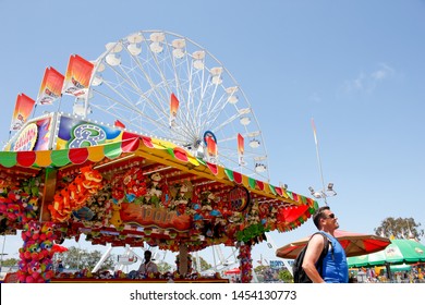 Costa Mesa, California/United States - 07/17/2019: A View Of A Giant Ferris Wheel And Carnival Game Tent Located At The Orange County Fair