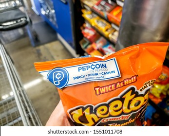 Costa Mesa, California/United States - 09/22/2019: A Hand Holds A Bag Of Cheetos, Featuring A Promotion Banner On The Bag For Pepcoin By PepsiCo