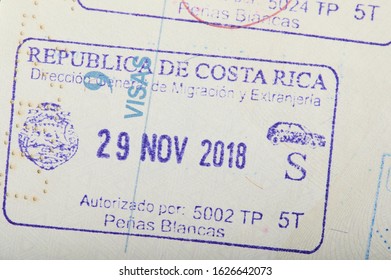 Costa Rica arrival stamp on passport page close up view