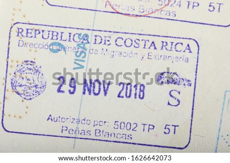 Costa Rica arrival stamp on passport page close up view