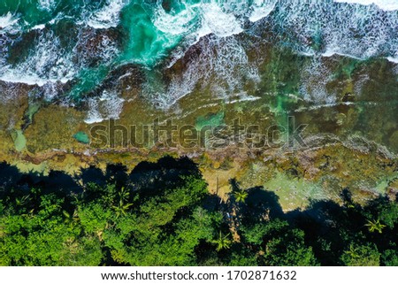 Similar – Aerial Drone View Of Dramatic Ocean Waves Crushing On Rocky Landscape