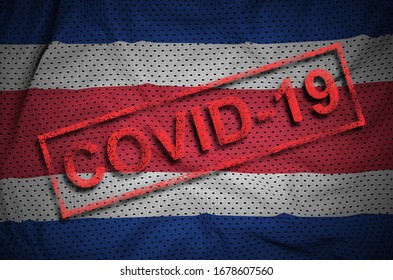 Costa Rica flag and red Covid-19 stamp. Coronavirus 2019-nCov outbreak