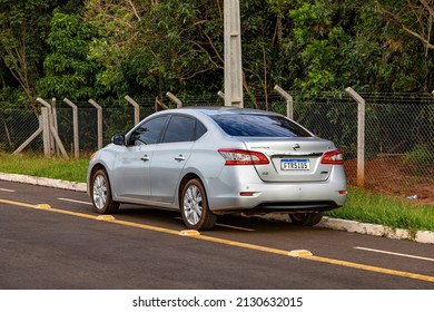 Costa Rica, Mato Grosso Do Sul, Brazil - 12 18 2022: Silver Sedan Car Of The Nissan Sentra Model With New License Plate Standard Implemented In Th