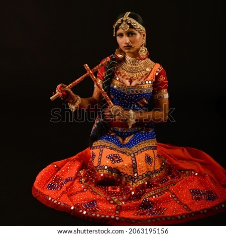 Costume and poses for western Indian folk dance Garba performed during night time by locals during Hindu festival Navaratri and Dassehra.