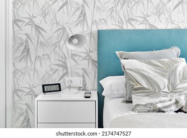 Cosy Bedroom With Grey Pillows,  Turquoise Headboard And White Bedside Table, Background, No People. Store Ad For Comfort Life And Cute Interior Design Details