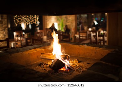 Cosy Fireplace In A Mountain Chalet's Warm, Wooden Interior