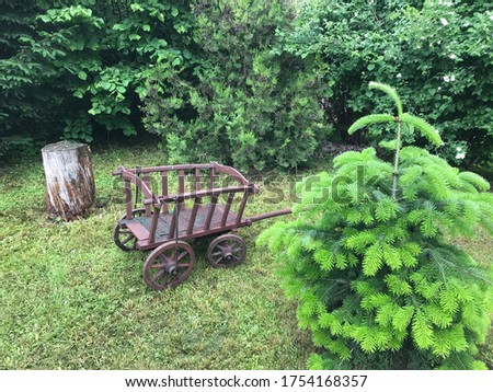 Cosy Garden Nook with a Small Hay Wagon