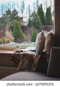 Cosy Place On A Window Sill For Reading And Daydreaming. Early Spring, Light Snow. Stay Home During Covid 19 Quarantine