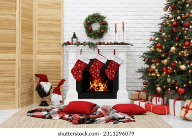 Cosy room with tree and fireplace decorated for Christmas. Interior design - Powered by Shutterstock