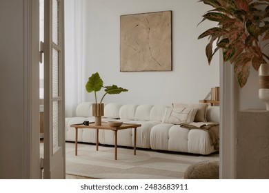 Cosy and stylish interior design of living room with modular white sofa, wooden furnitures, paintings on the wall, decorations, windowsill and personal accessories. Home styling. Template. - Powered by Shutterstock