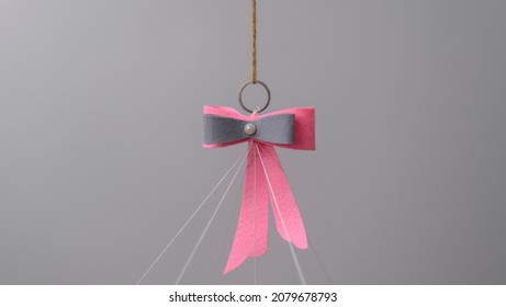 Cot Mobile Hanging Felt Bow And Ring Closeup.