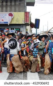 COTACACHI, ECUADOR - JUNE 25, 2016: Inti Raymi, The Quechua Solstice Celebration, With A History Of Violence In Cotacachi.  Men Stomp And Dance To Awaken Mother Earth. 