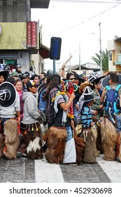 COTACACHI, ECUADOR - JUNE 25, 2016: Inti Raymi, The Quechua Solstice Celebration, With A History Of Violence In Cotacachi.  Men Stomp And Dance To Awaken Mother Earth.