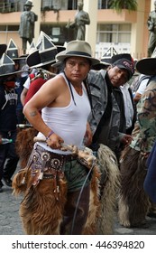 COTACACHI, ECUADOR - JUNE 30, 2016: Inti Raymi, The Quechua Solstice Festival, With A History Of Violence In Cotacachi.  Costumed Men Stomp And Dance To Awaken Mother Earth.