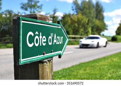 Cote D'Azur (French Riviera) Sign Against Sportive Car On The Rural Road