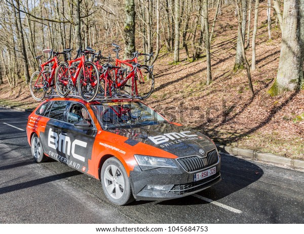 Cote de\
Senlisse,, France - March 5, 2017: The technical car of BMC Racing\
Team driving in the caravan of technical vehicles during the first\
stage of Paris-Nice on 5 March,\
2017.