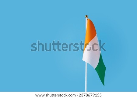 cote d'ivoire flag on a blue background, copy space, independence national day of cote d'ivoire, country freedom, patriotism
