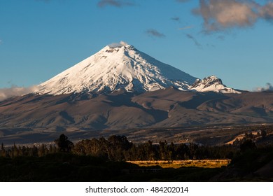 Cotopaxi Volcano Appears In The Clouds, Light Snow And Pure Ice