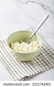 Cottage Cheese In Bowl On White Background