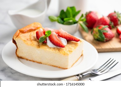 Cottage Cheese Casserole Or Pudding Served With Fresh Cream And Strawberries. Healthy Breakfast Food, Sweet Snack Or Meal Rich In Protein, Calcium