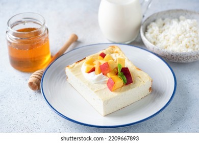 Cottage Cheese Casserole Zapekanka With Peach, Sour Cream And Honey. Sweet Breakfast Cheese Cake