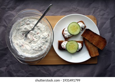 Cottage Cheese Dip With Cucumber Slices On Black Bread Toast. Breakfast. Space For Text.