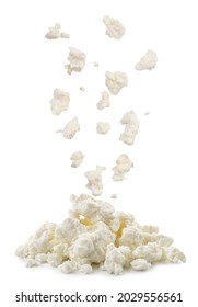Cottage cheese drops on a heap close-up on a white background. Isolated