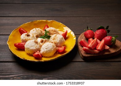 Cottage cheese dumplings with strawberry. Boiled, breakfast