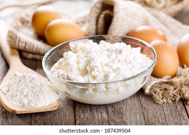  Cottage Cheese, Eggs And Flour On Wooden Table