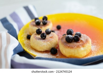 Cottage Cheese Pancakes With Berries Currants On A Serving Board, Plate On Table. Tasty Healthy Diet Food On Breakfast, Lunch, Dinner, Snack. Closeup Soft Focus