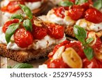 Cottage cheese and roasted tomatoes sourdough bread toast on a wooden board.