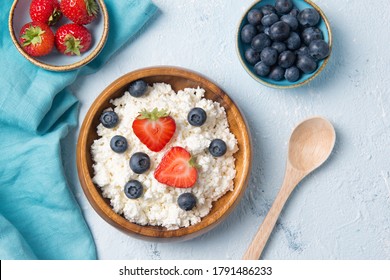 Cottage cheese with strawberry and blueberry, fresh berries, healthy breakfast concept, top view - Shutterstock ID 1791486233