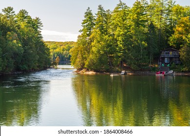 Cottage Country Scene In Muskoka District  Ontario Canada Featuring Lake With Cottage On A Sunny Summer Day