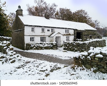 Cottage Farmhouse In Winter Snow, Little Langdale, English Lake District, Cumbria, England, UK.