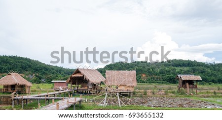 Cottage hand made from bamboo behind beautiful mountain and sky, Relaxing time in holiday at Thailand. Chiang Dao ,Chiang Mai ,Thailand.