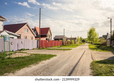 Cottage house on village street on a sunny day in summer