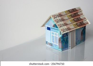 Cottage made of euro banknotes, housing loan. 