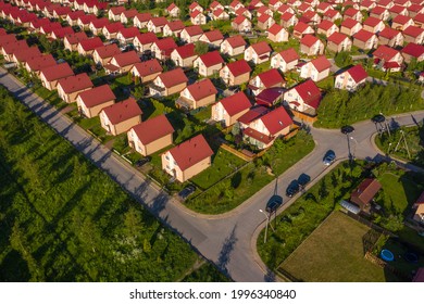 Cottage Village View From The Drone. Suburbia On A Summer Day. Empty Road Next To Cottage Villag. Similar Houses With Lawns. Cottage Village With Two-storey Houses. Concept - Buying A Country House